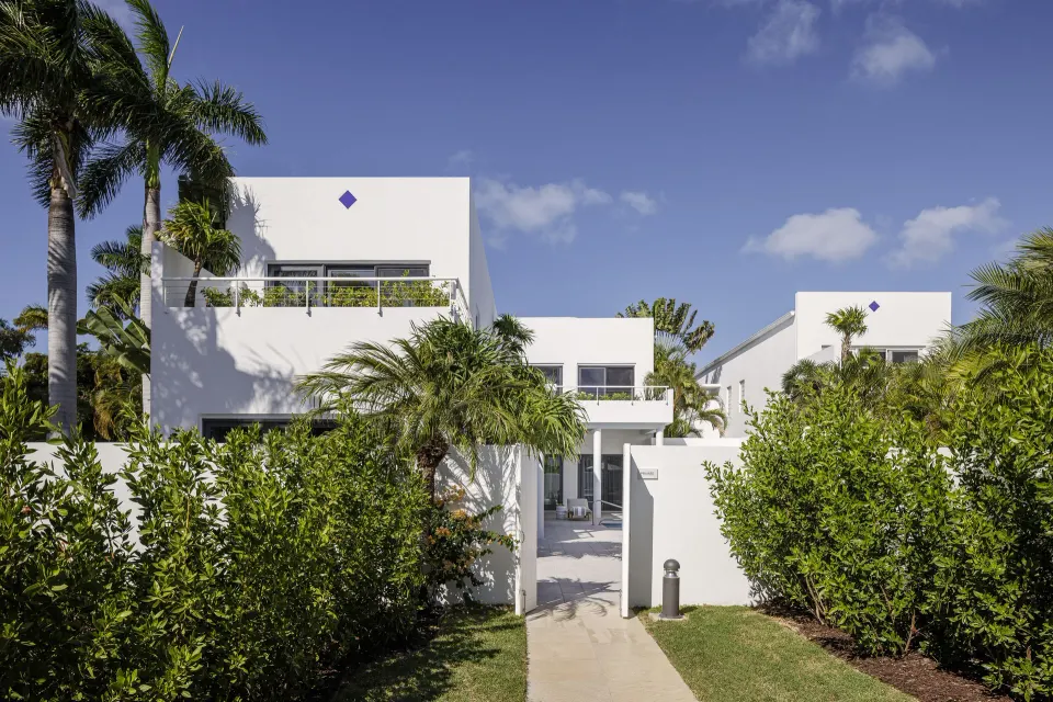Five Bedroom Garden Villa exterior with palms at Aurora Anguilla Resort & Golf Club.