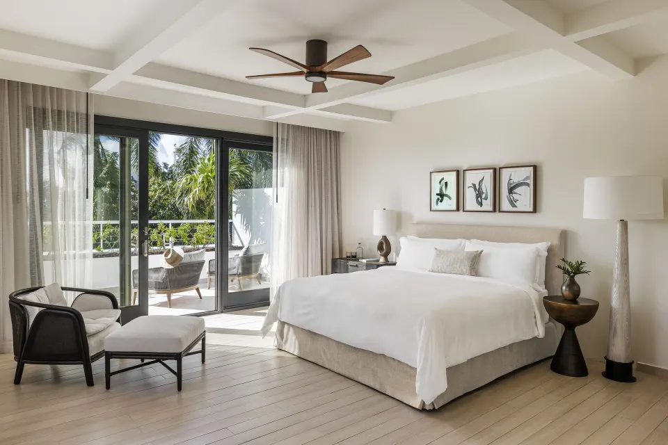 Five Bedroom Garden Villa king bedroom with balcony at Aurora Anguilla Resort & Golf Club.