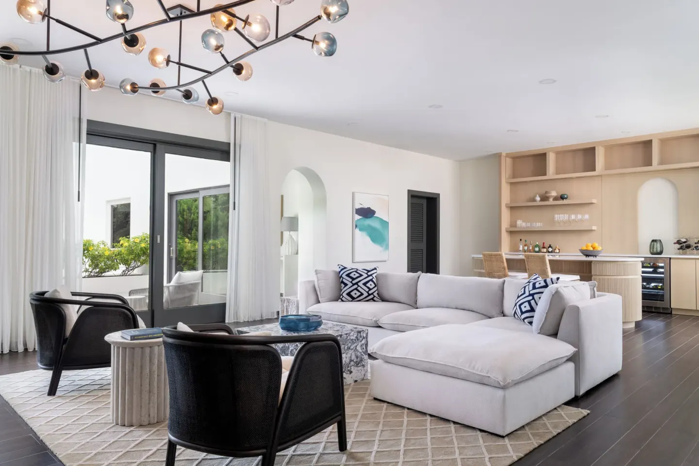 Five Bedroom Garden Villa living room with sectional sofa at Aurora Anguilla Resort & Golf Club.