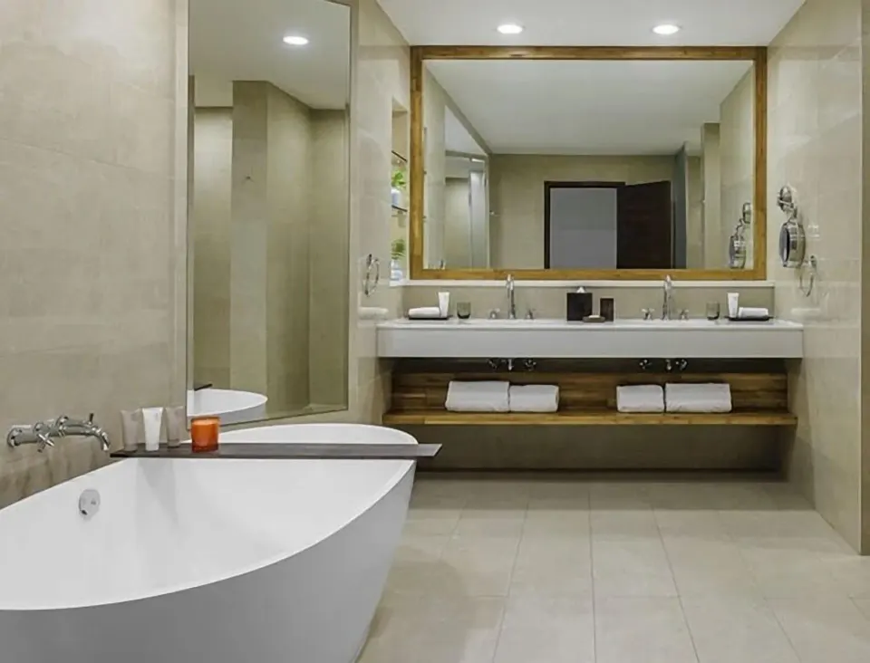 Island View Deluxe Room bathroom with soaking tub at Aurora Anguilla Resort & Golf Club.