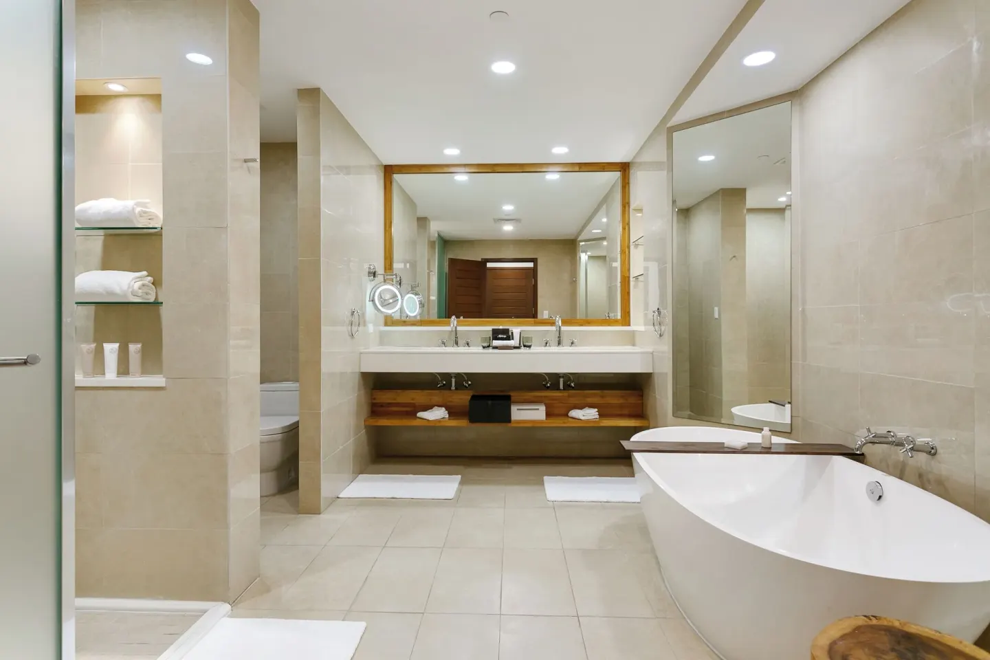 Island View Deluxe Room bathroom vanity and tub at Aurora Anguilla Resort & Golf Club.