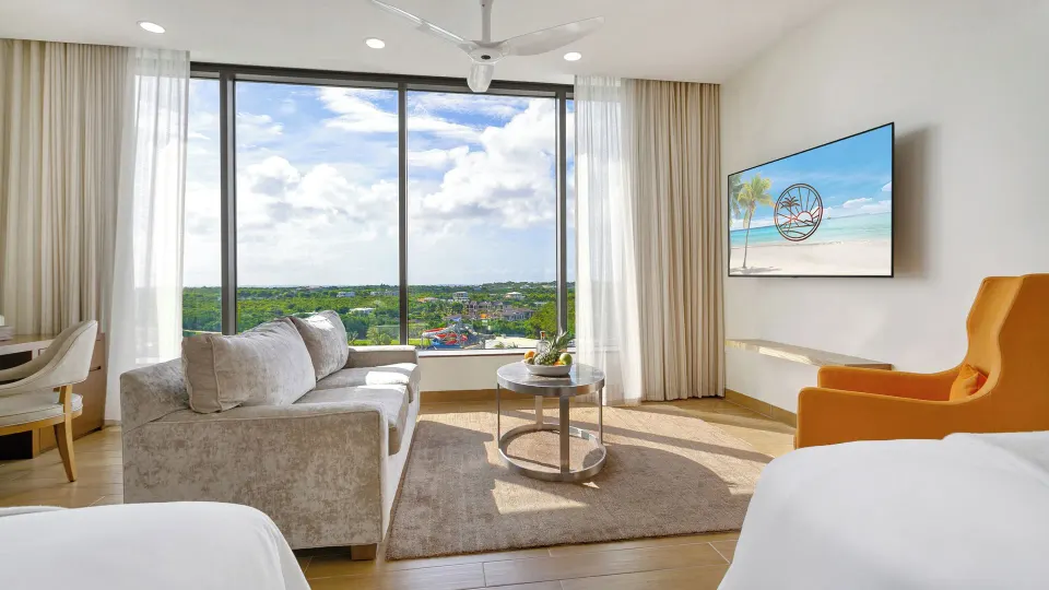 Island View Deluxe Room lounge and window view at Aurora Anguilla Resort & Golf Club.