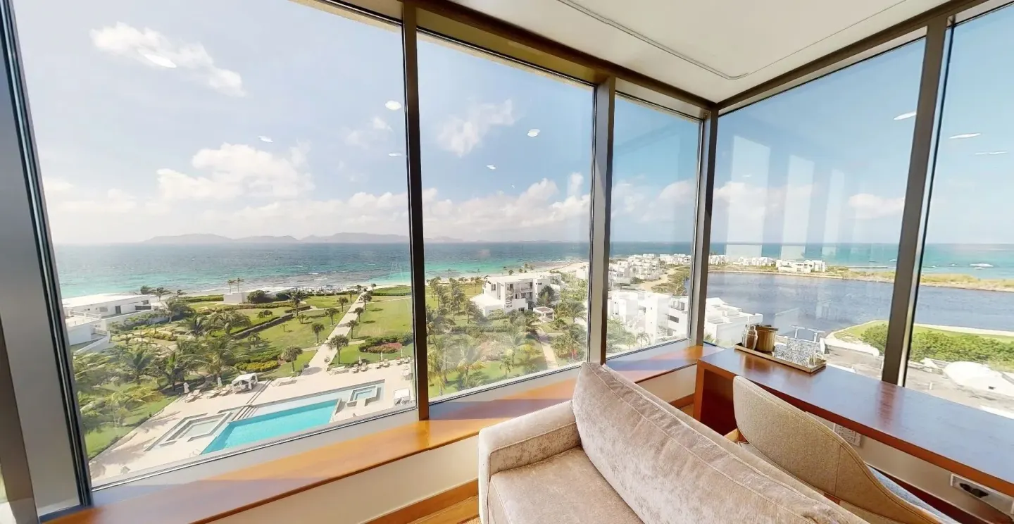 Ocean View Deluxe Room windows overlooking the sea at Aurora Anguilla Resort & Golf Club.