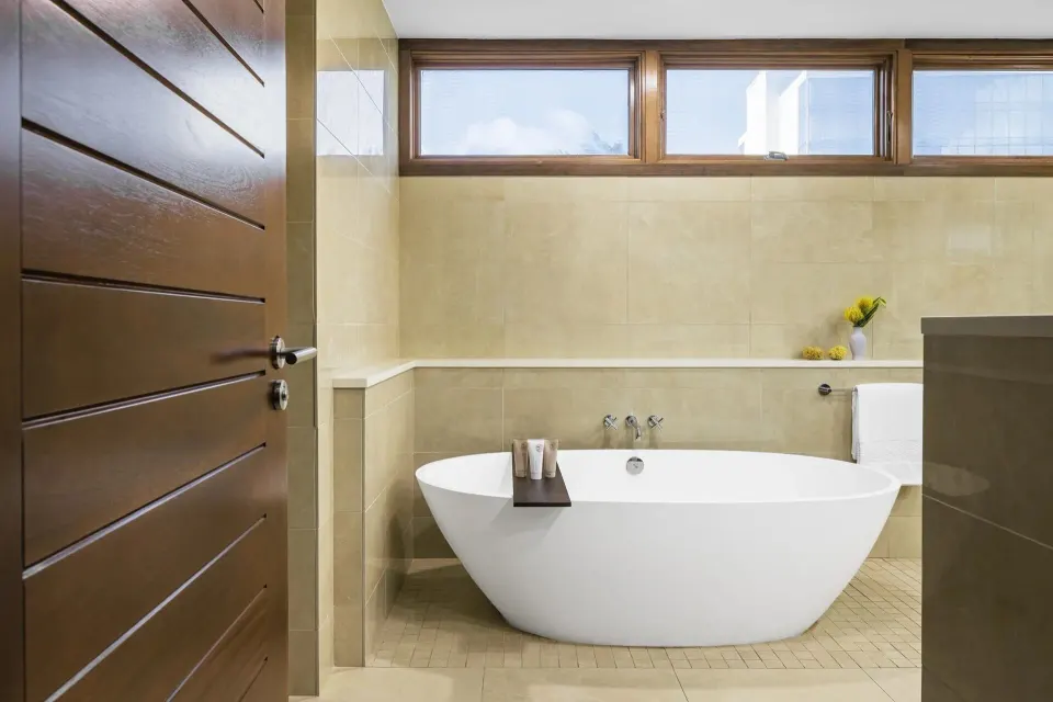 Freestanding soaking tub in an Oceanfront Junior Suite bathroom at Aurora Anguilla Resort & Golf Club.