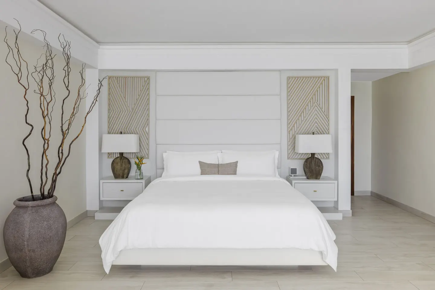 King bed in a Resort View Junior Suite at Aurora Anguilla Resort & Golf Club.