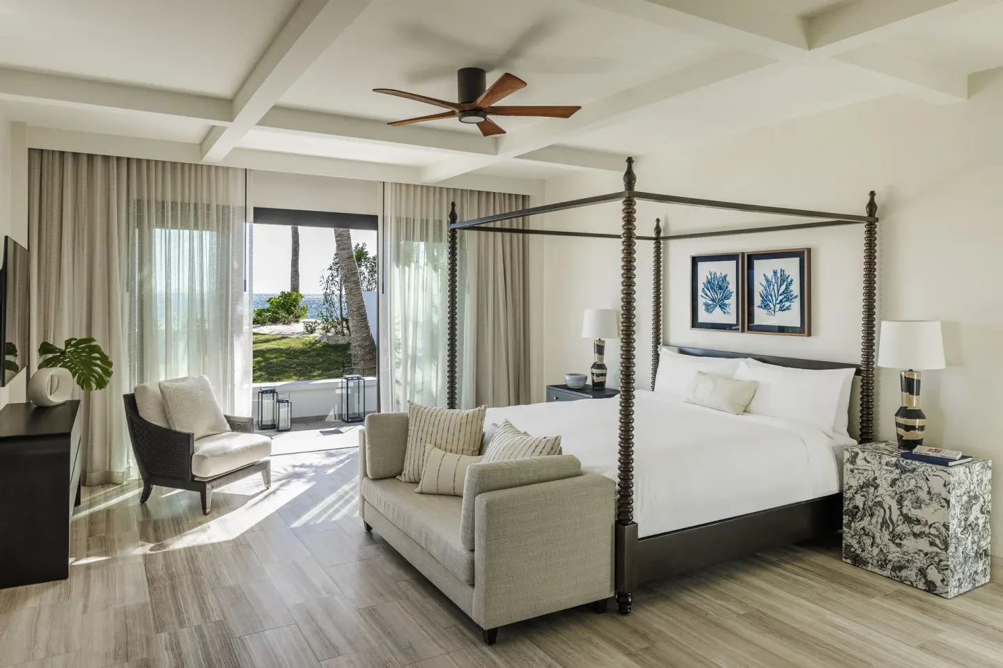 Four-poster king bedroom in the Three Bedroom Beachfront Villa at Aurora Anguilla Resort & Golf Club.