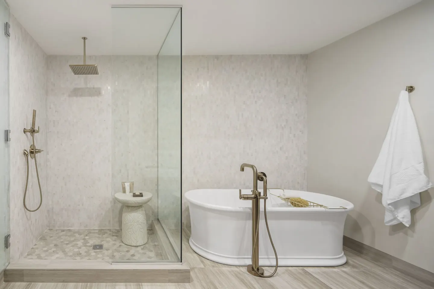 Villa bathroom with soaking tub and glass shower at Aurora Anguilla Resort & Golf Club.