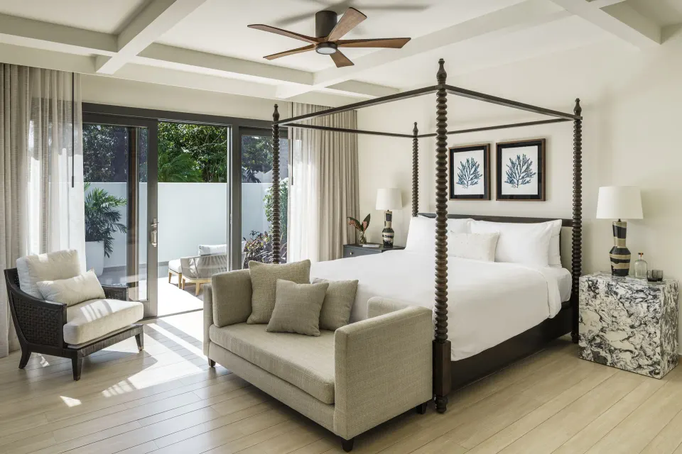 Four-poster king bedroom in a Three Bedroom Garden Villa at Aurora Anguilla Resort & Golf Club.