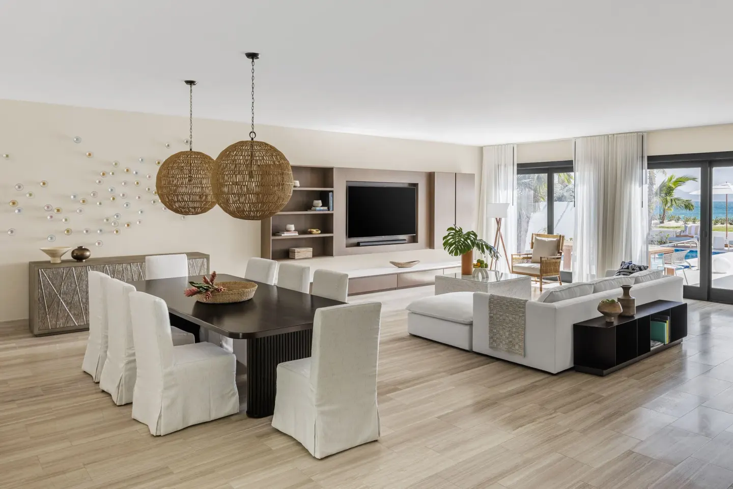 Living and dining area in a Three Bedroom Garden Villa at Aurora Anguilla Resort & Golf Club.