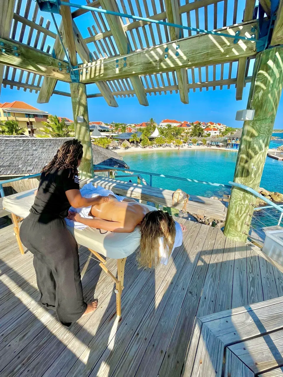 Open-air massage on a deck overlooking the lagoon at Avila Beach Hotel.