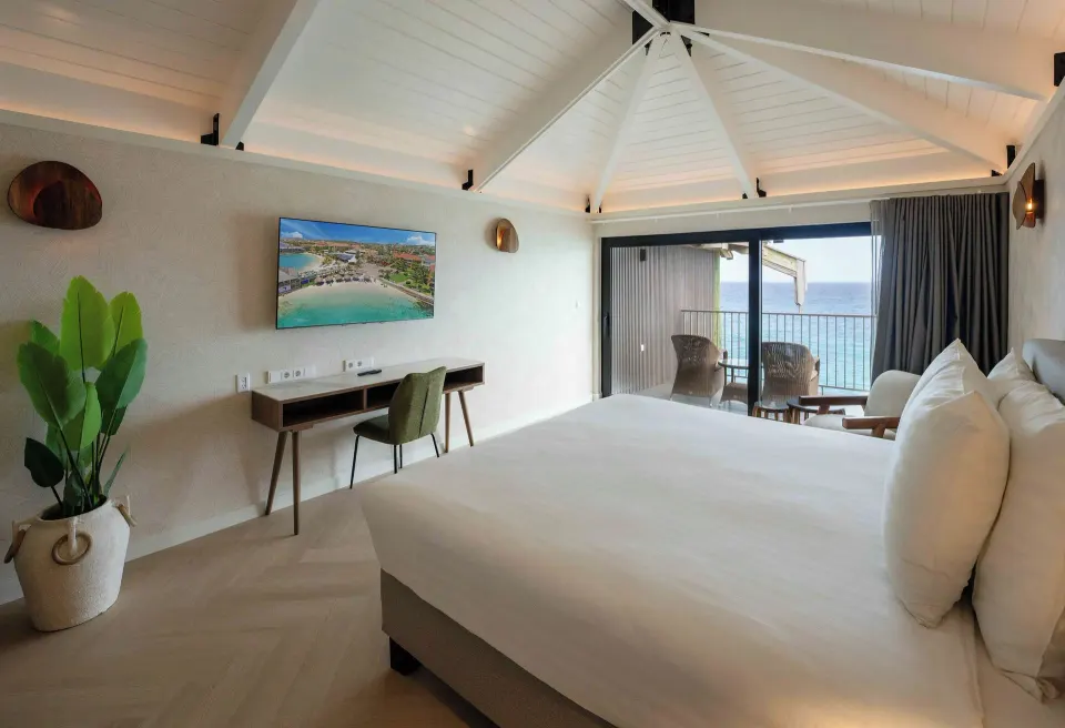 Deluxe Oceanfront king room with desk, TV, and balcony view at Avila Beach Hotel.