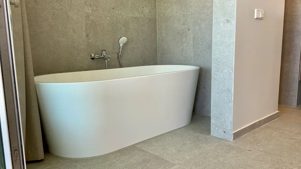 Deluxe Room octagon bathroom with freestanding tub at Avila Beach Hotel.