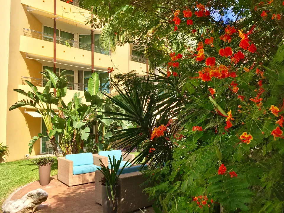 Garden seating and balconies near the Deluxe Room octagon at Avila Beach Hotel.