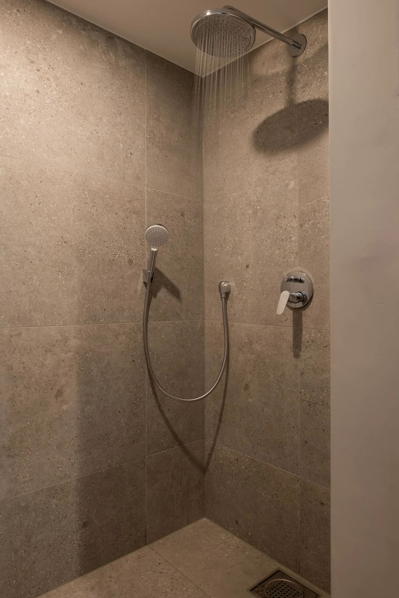Preferred Room walk-in shower with rainfall and handheld fixtures at Avila Beach Hotel.