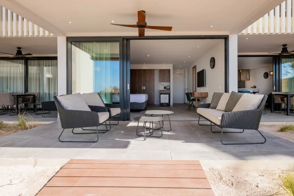 Premium apartment beachfront terrace with seating outside the rooms at Avila Beach Hotel.