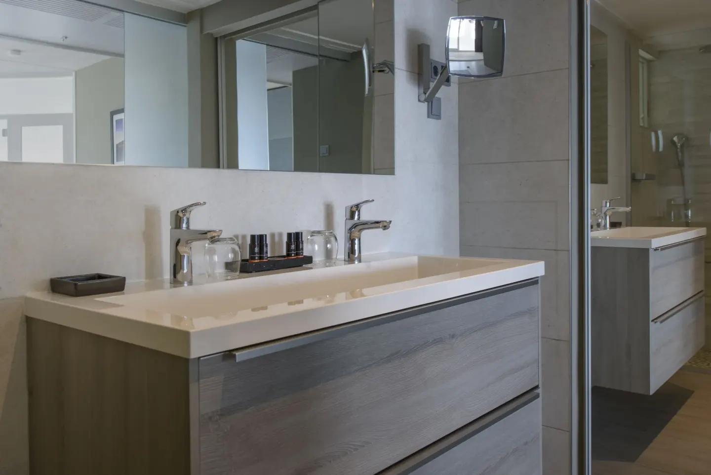 Royal Three Bedroom Apartment bathroom vanity and mirror at Avila Beach Hotel.