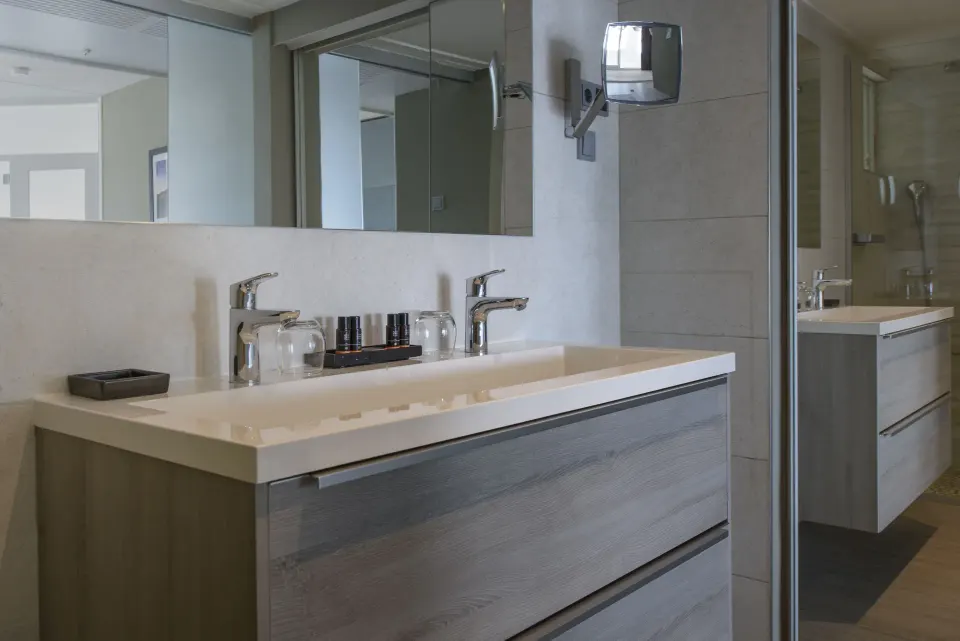Royal Three Bedroom Apartment bathroom vanity and mirror at Avila Beach Hotel.