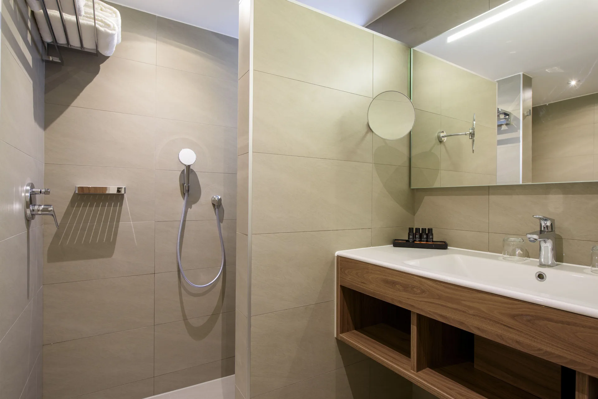 Standard Room bathroom with walk-in shower and vanity at Avila Beach Hotel.