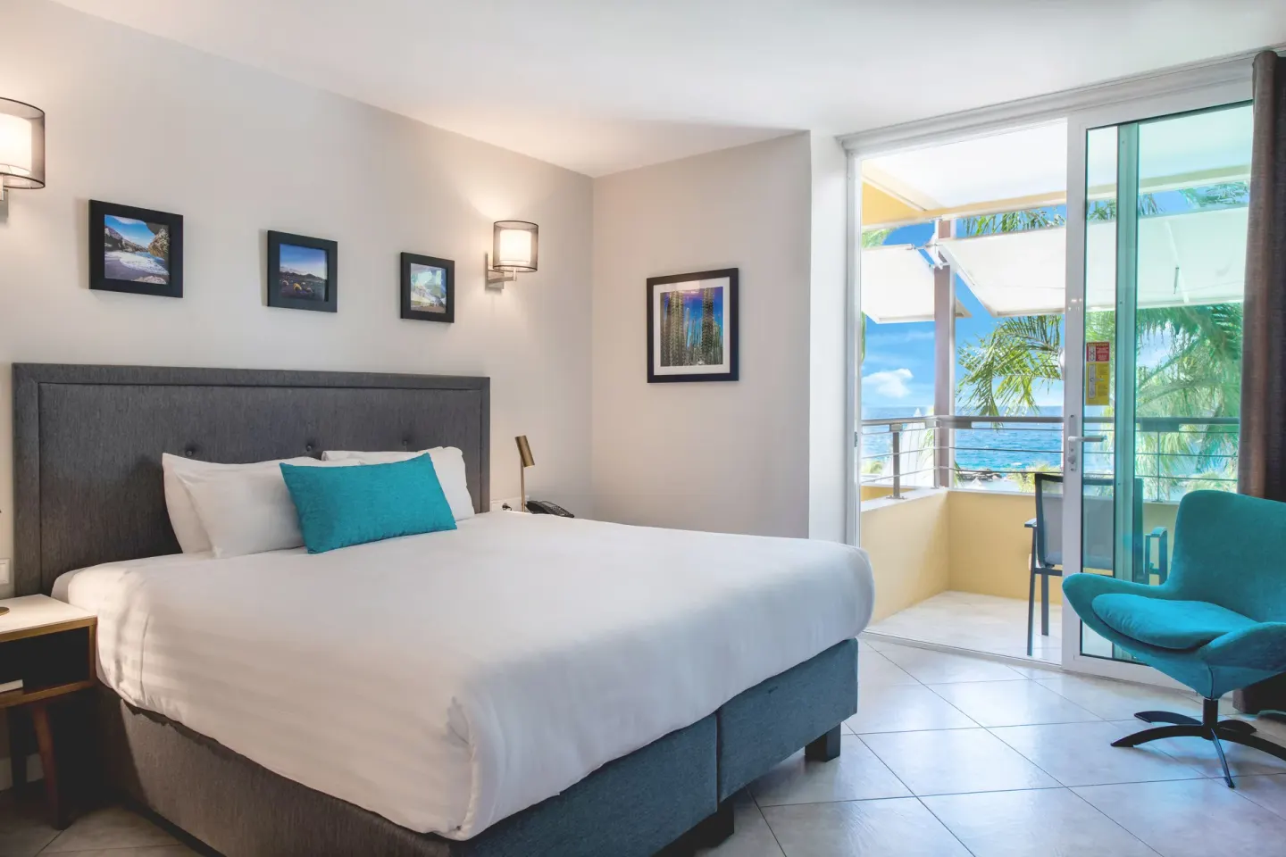 Standard Room king bed with balcony and ocean view at Avila Beach Hotel.