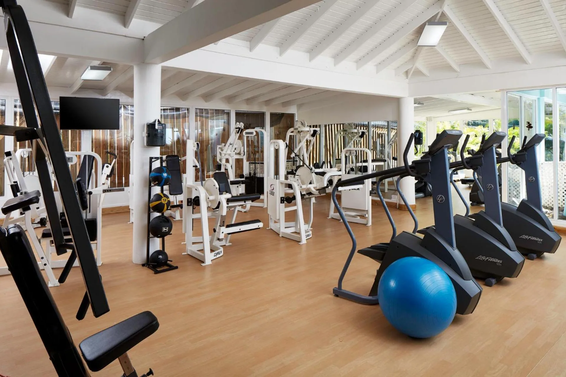 Fitness center with cardio machines and weight equipment at Azul Beach Resort Negril.