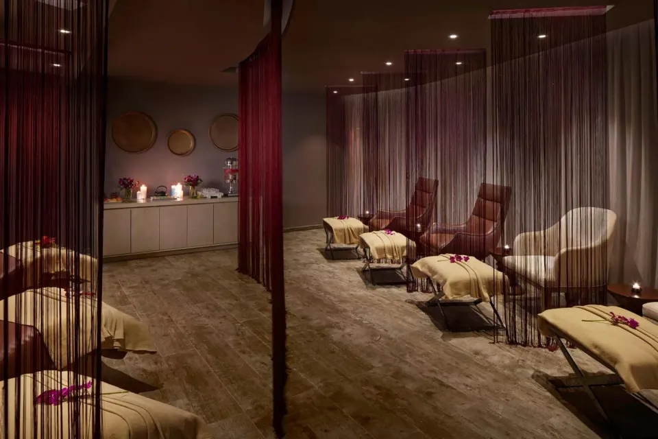 Spa relaxation lounge with curtained loungers at Azul Beach Resort Negril.