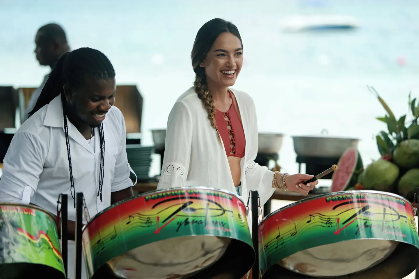 Guest playing steel pan drums by the beach at Azul Beach Resort Negril.