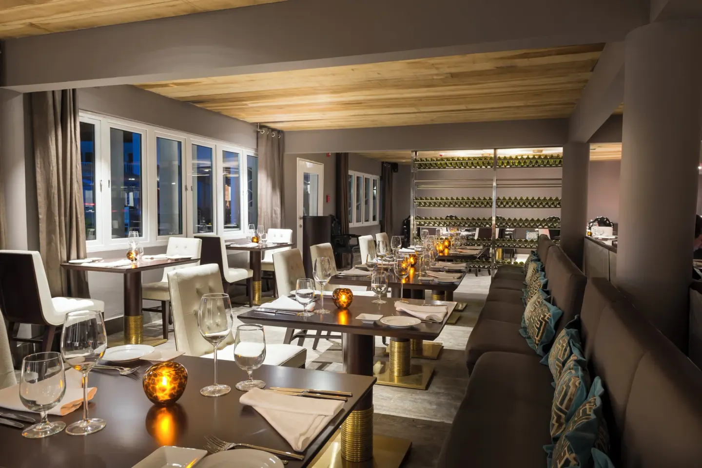 Intimate restaurant dining room with wine display at Azul Beach Resort Negril.