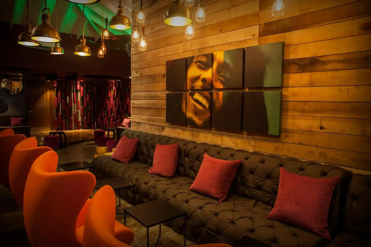 Lounge seating with warm lighting and wall art at Azul Beach Resort Negril.