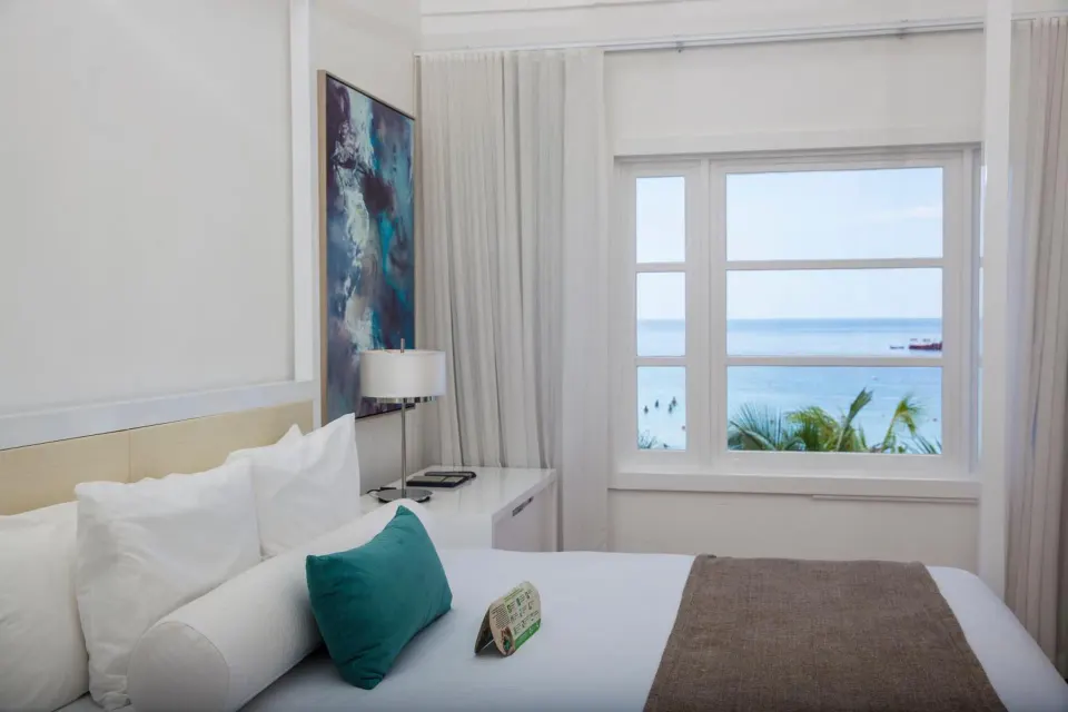 Honeymoon Suite beachfront king bed with ocean view at Azul Beach Resort Negril.