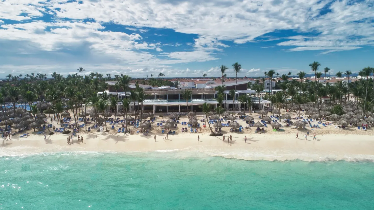 Aerial beachfront with turquoise water at Bahia Principe Escape Ambar.