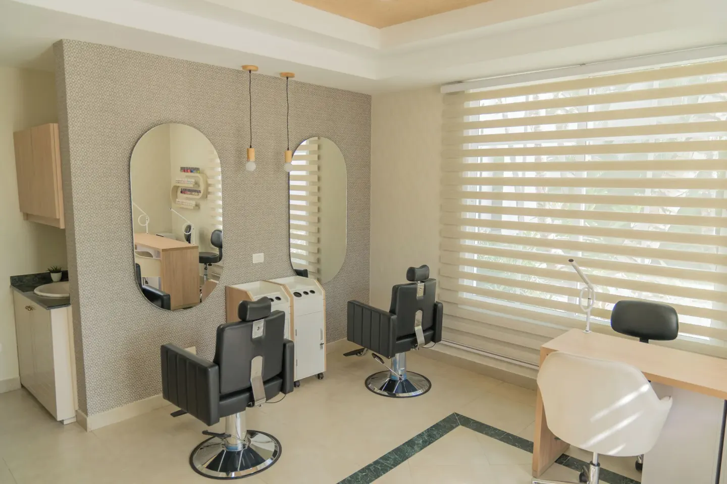Salon chairs, mirrors and manicure stations at Bahia Principe Escape Ambar.
