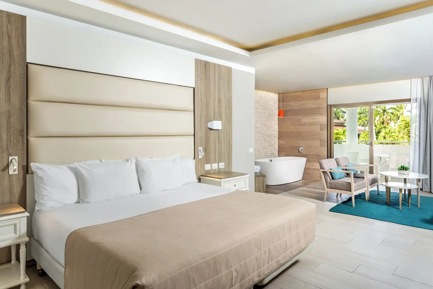 Corner Junior Suite with king bed and soaking tub at Bahia Principe Escape Ambar.