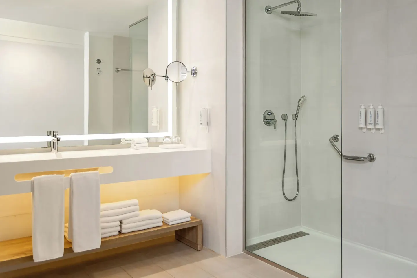 Bathroom vanity and glass shower in a Junior Suite Corner Swim Up at Bahia Principe Escape Ambar.