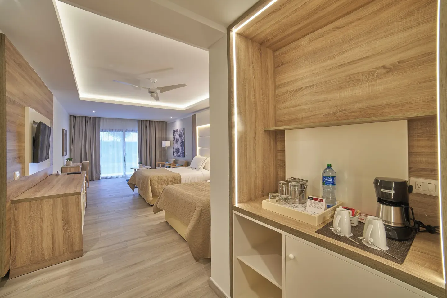 Junior Suite Deluxe refreshment station beside two beds at Bahia Principe Escape Ambar.