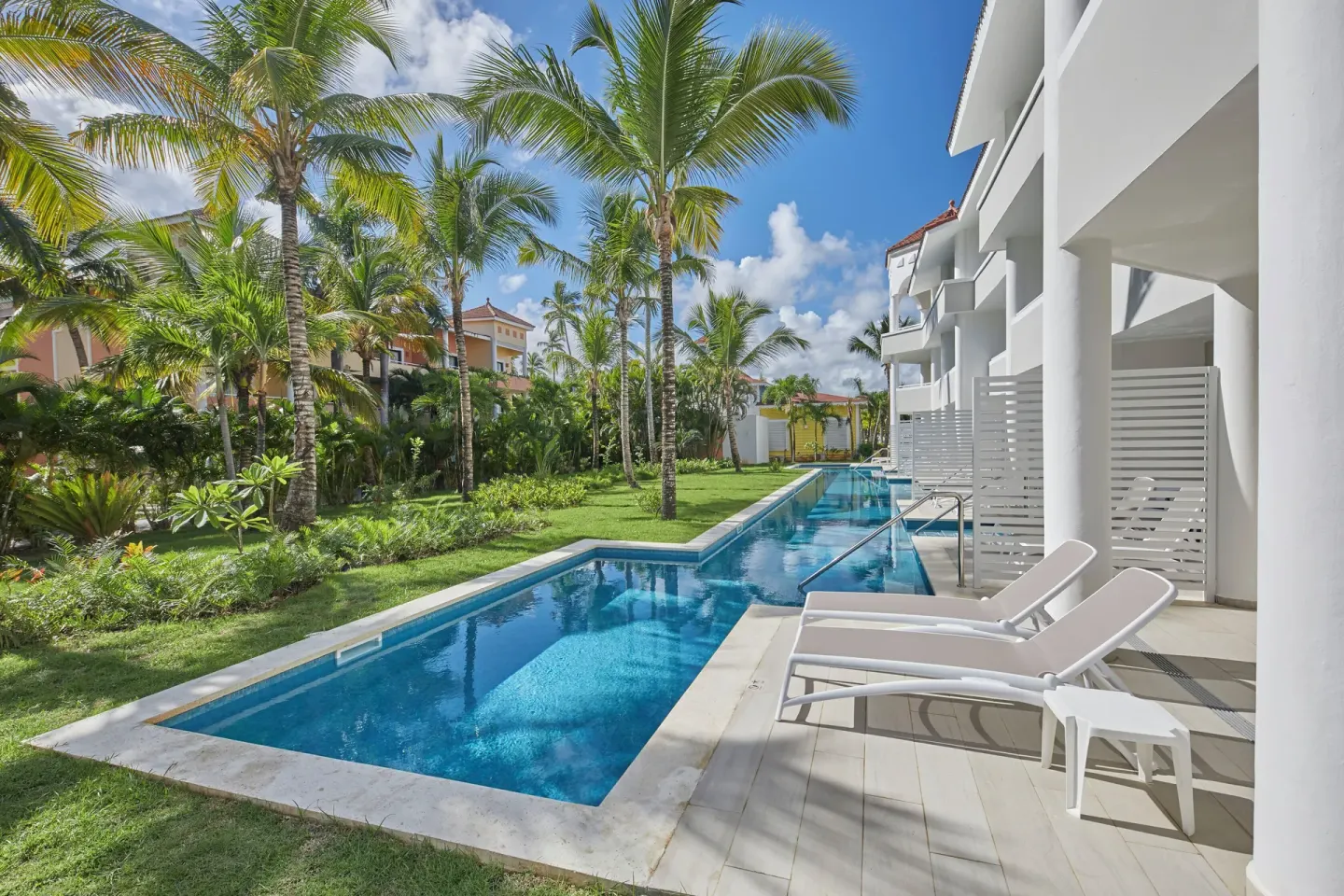Junior Suite Swim Up pool terrace and tropical gardens at Bahia Principe Escape Ambar.