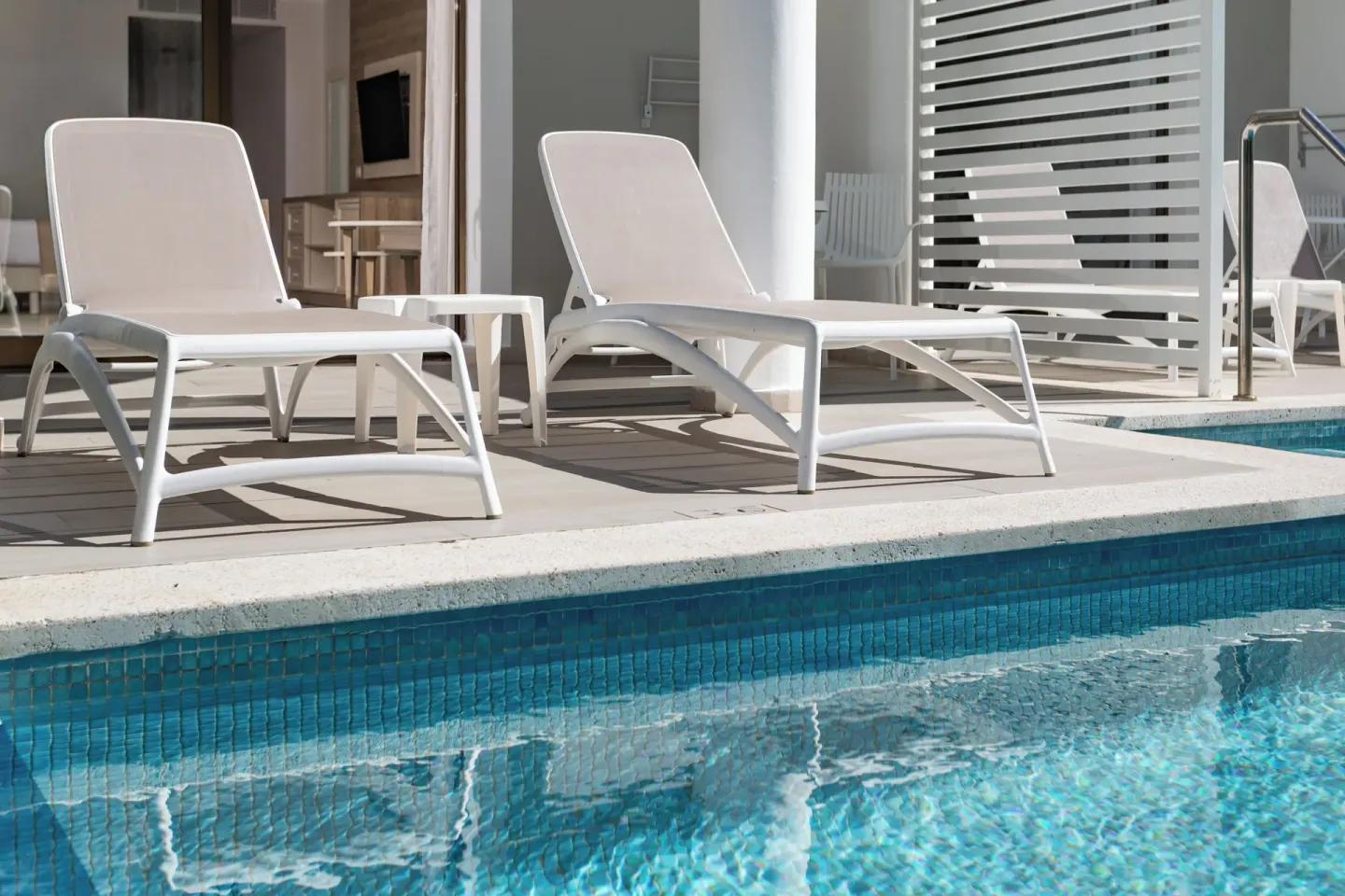 Junior Suite Swim Up terrace with loungers by the pool at Bahia Principe Escape Ambar.
