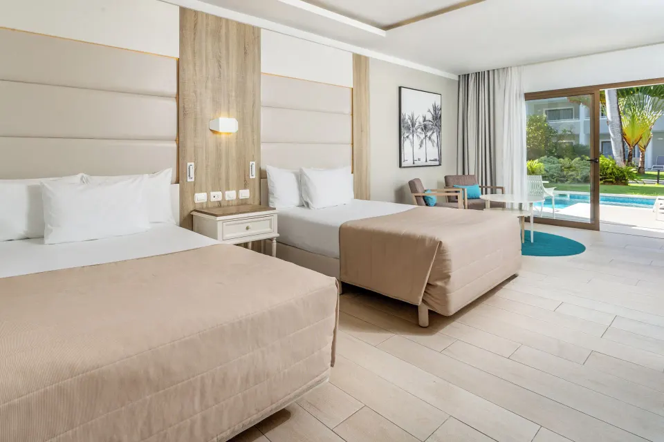 Junior Suite Swim Up with two beds and pool access at Bahia Principe Escape Ambar.
