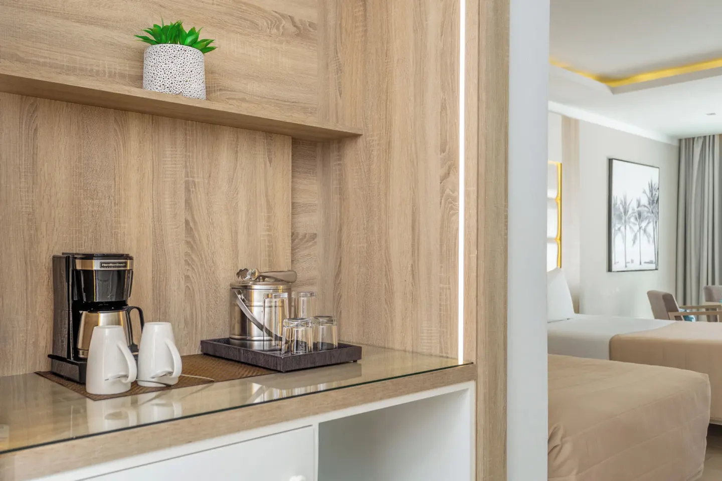 Junior Suite coffee station with beds beyond at Bahia Principe Escape Ambar.