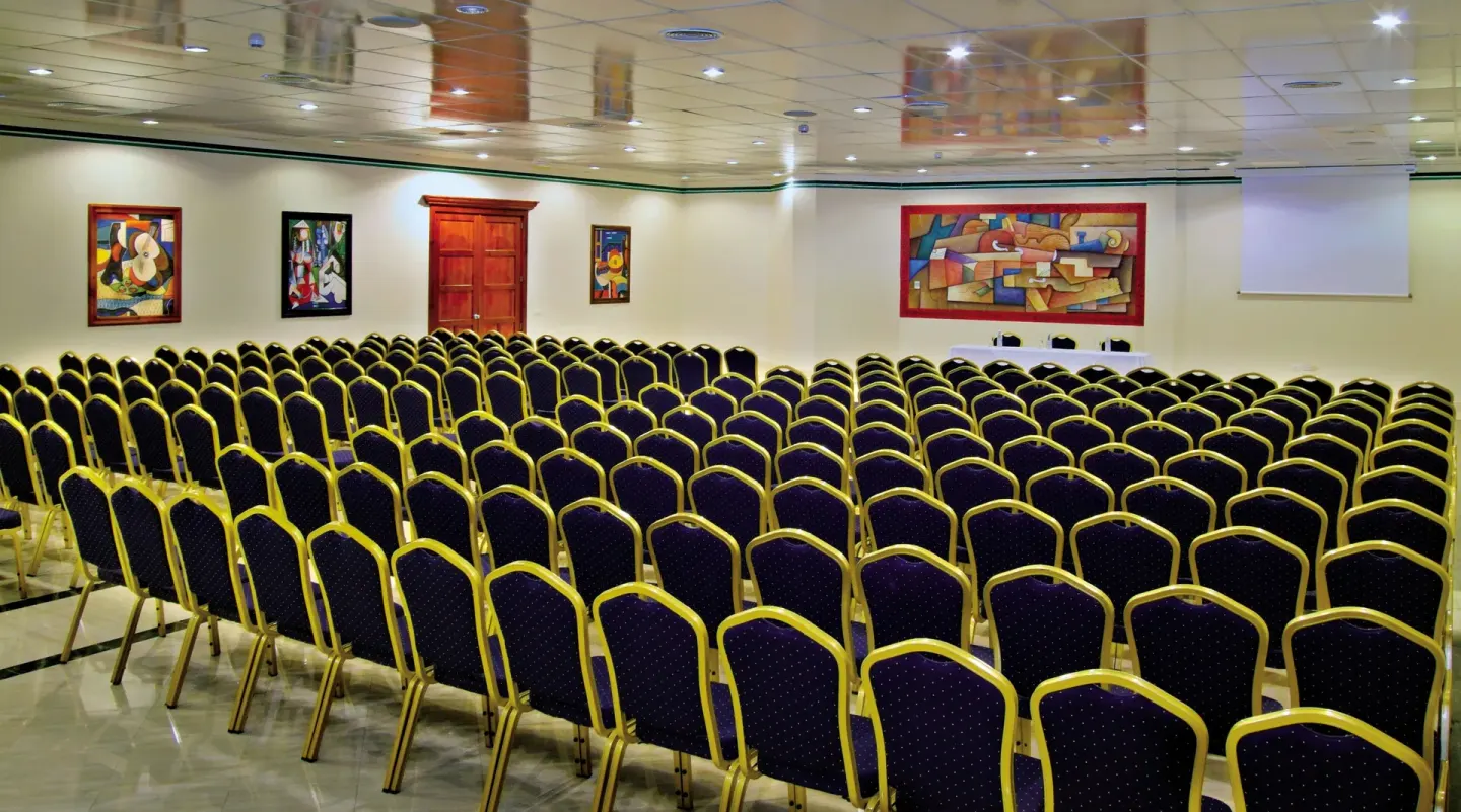 Conference room with rows of chairs at Bahia Principe Escape Ambar.