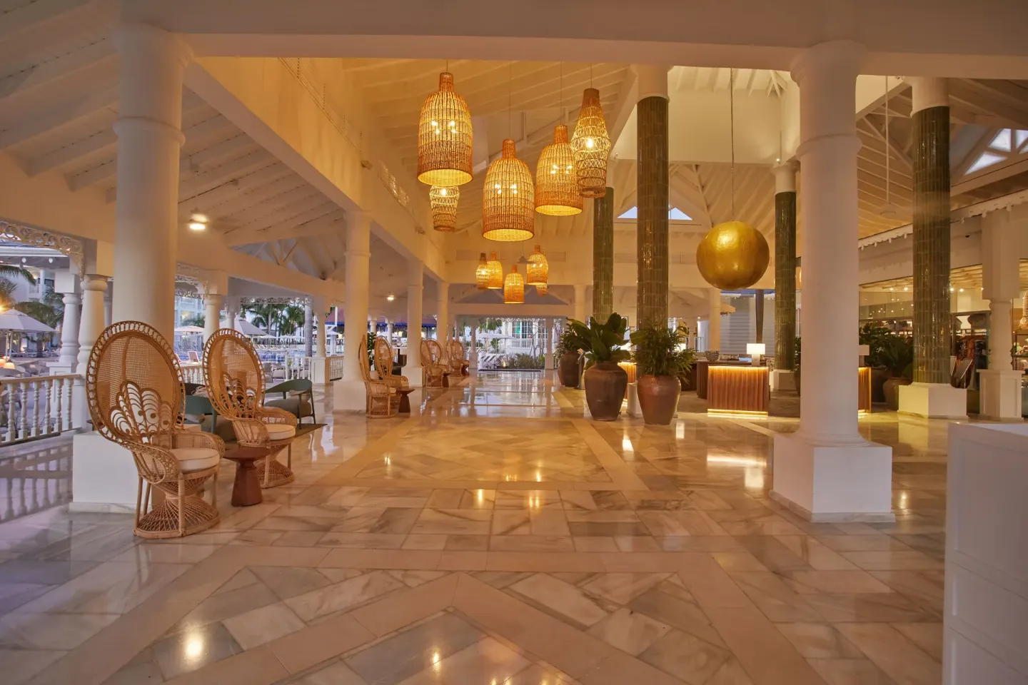 Evening lobby lounge with wicker chairs at Bahia Principe Explore Esmeralda.