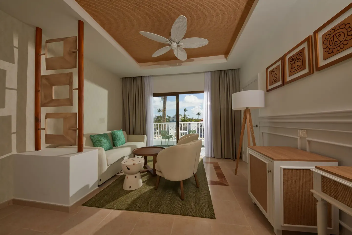 Guest room sitting area with balcony at Bahia Principe Explore Esmeralda.
