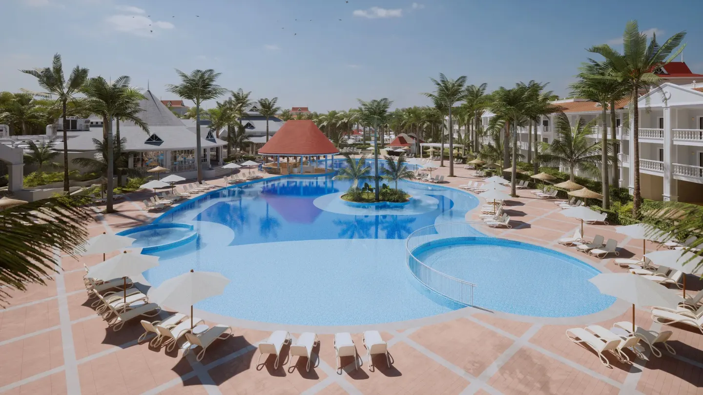 Large resort pool with palm island at Bahia Principe Explore Esmeralda.