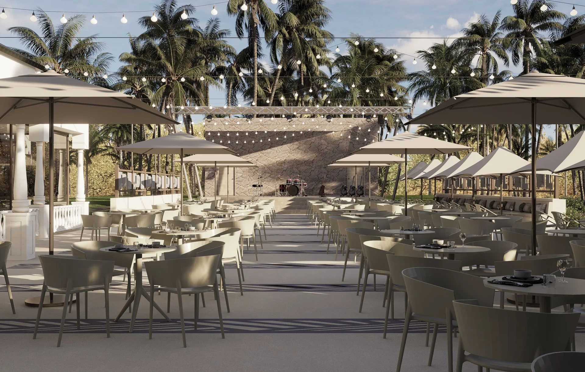 Outdoor dining terrace with stage and string lights at Bahia Principe Explore Esmeralda.