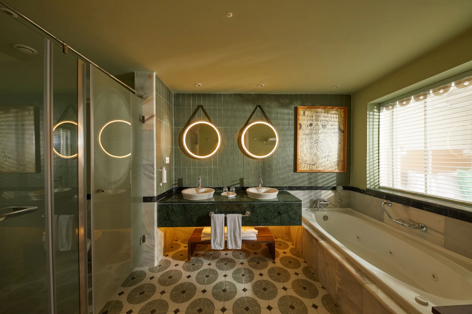 Junior Suite Deluxe Swim Up bathroom with double vanity and jetted tub at Bahia Principe Explore Esmeralda.