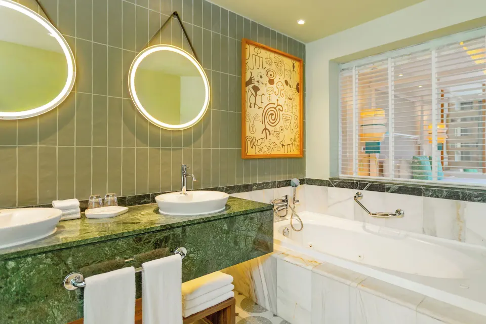 Junior Suite Deluxe bathroom vanity and bathtub at Bahia Principe Explore Esmeralda.