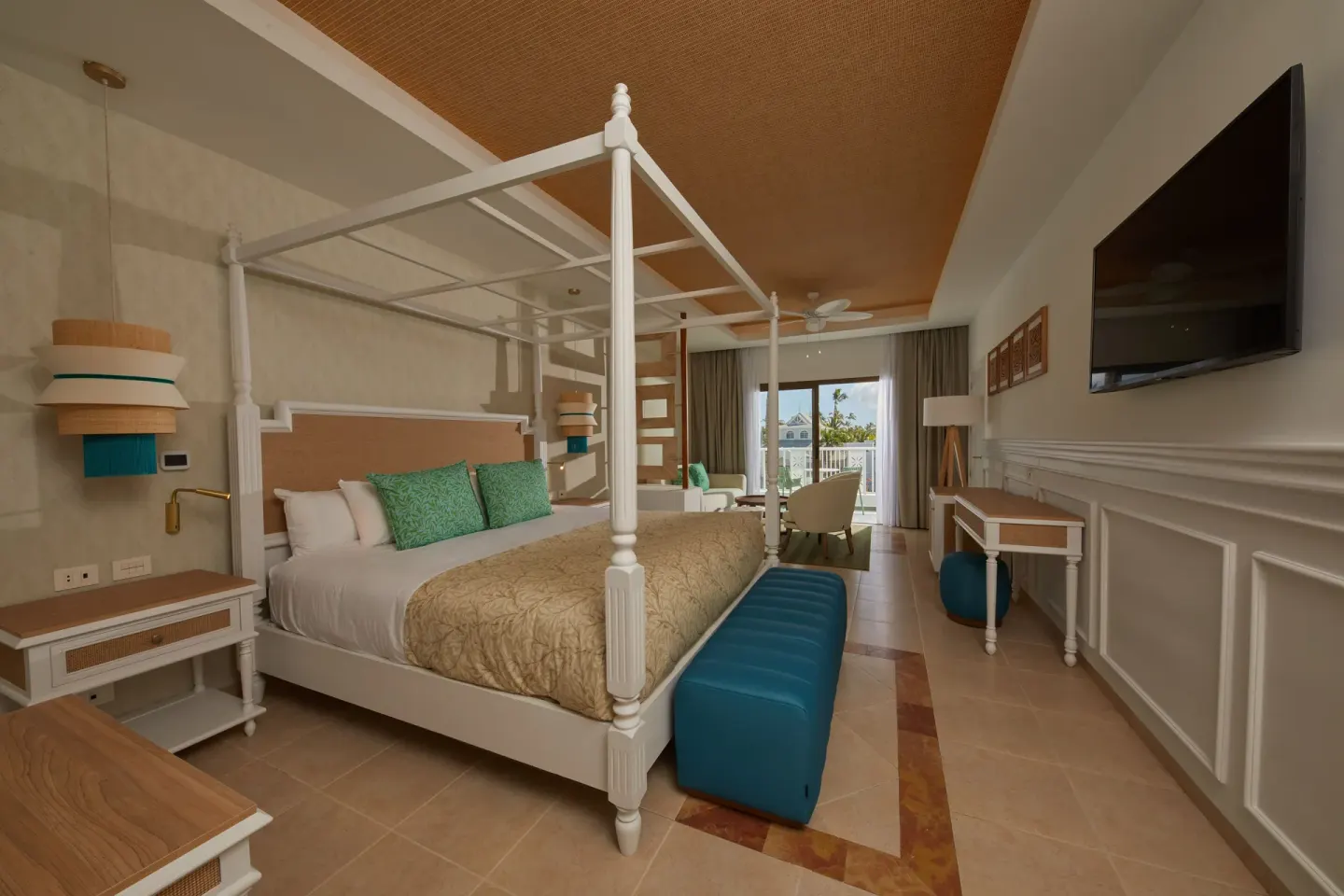 Junior Suite Deluxe king bed with balcony doors at Bahia Principe Explore Esmeralda.