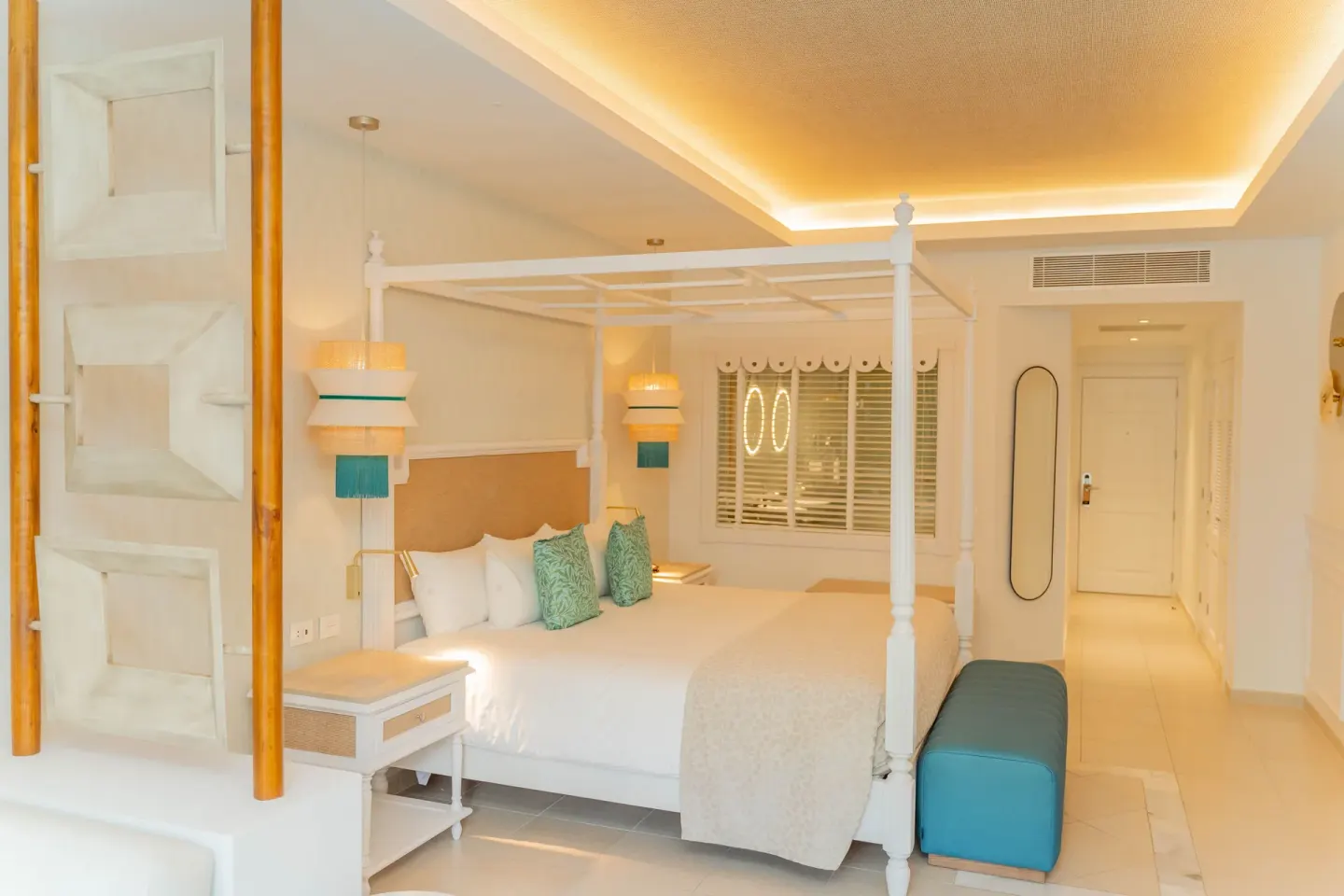 Junior Suite Deluxe king bed and entry hallway at Bahia Principe Explore Esmeralda.