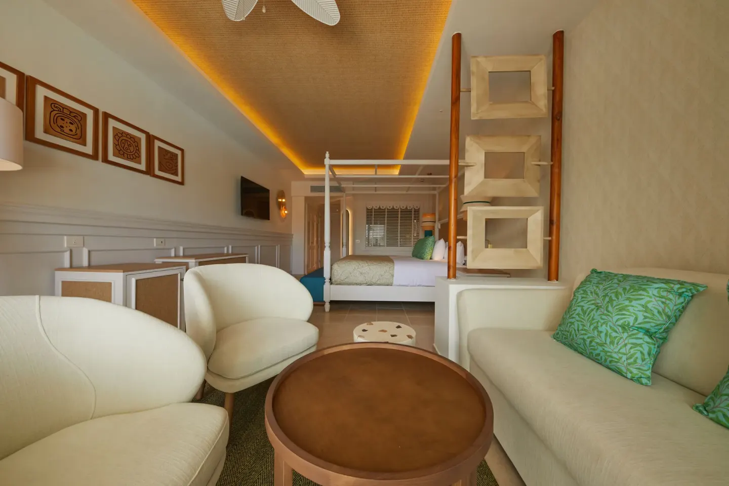 Junior Suite Deluxe lounge looking toward the king bed at Bahia Principe Explore Esmeralda.