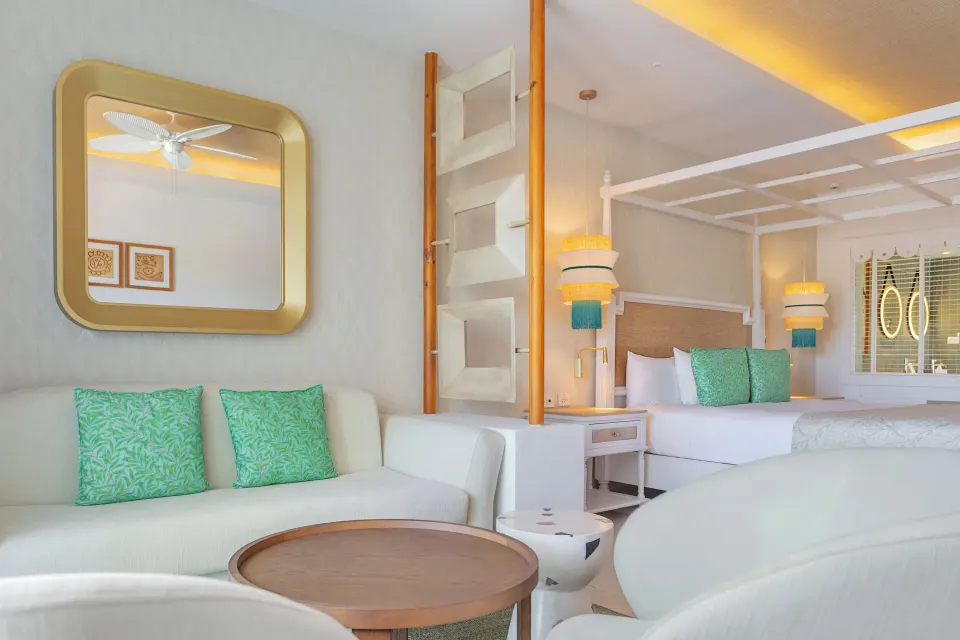 Junior Suite Deluxe lounge and canopy bed at Bahia Principe Explore Esmeralda.