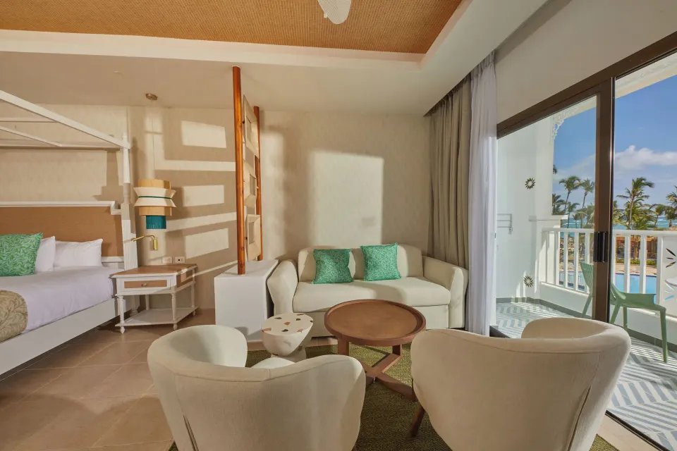Junior Suite Deluxe sitting area beside the balcony at Bahia Principe Explore Esmeralda.